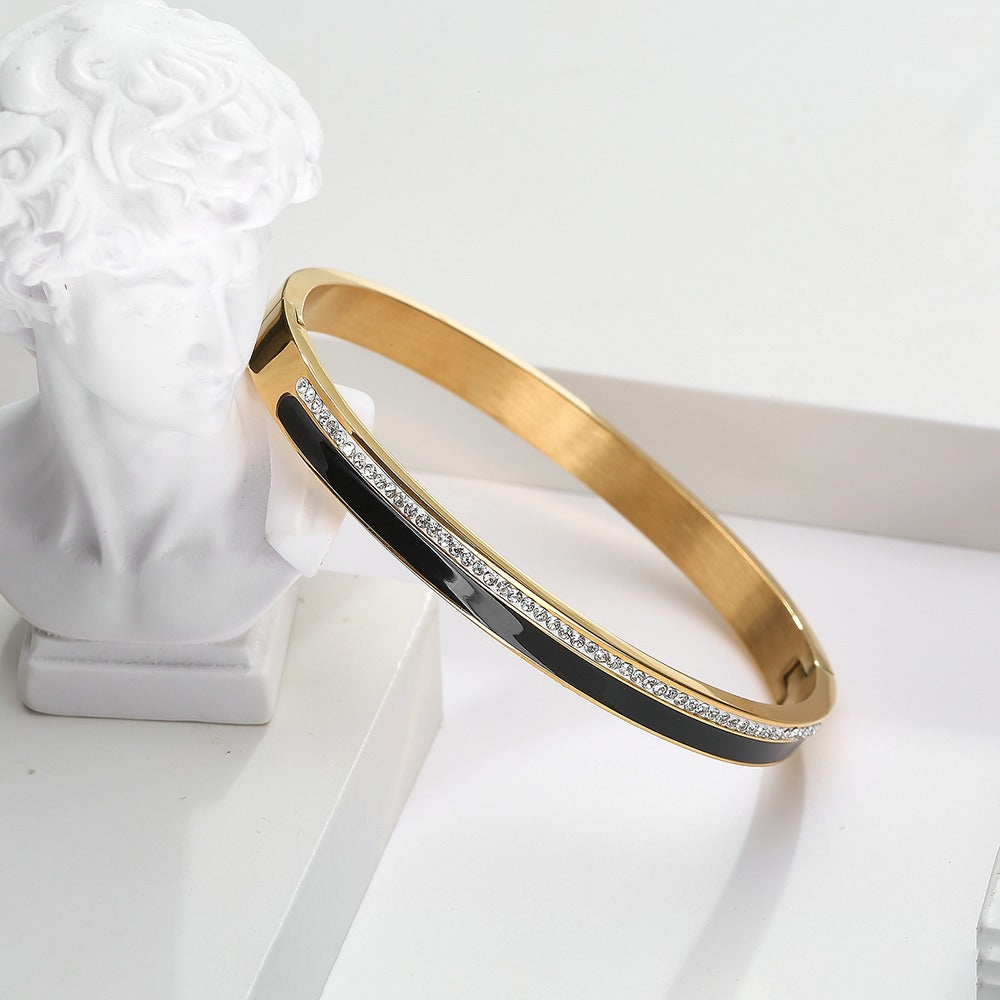 Bangle with zircon stones and black color design on top