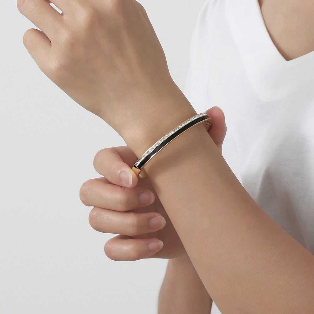 Bangle with zircon stones and black color design on top