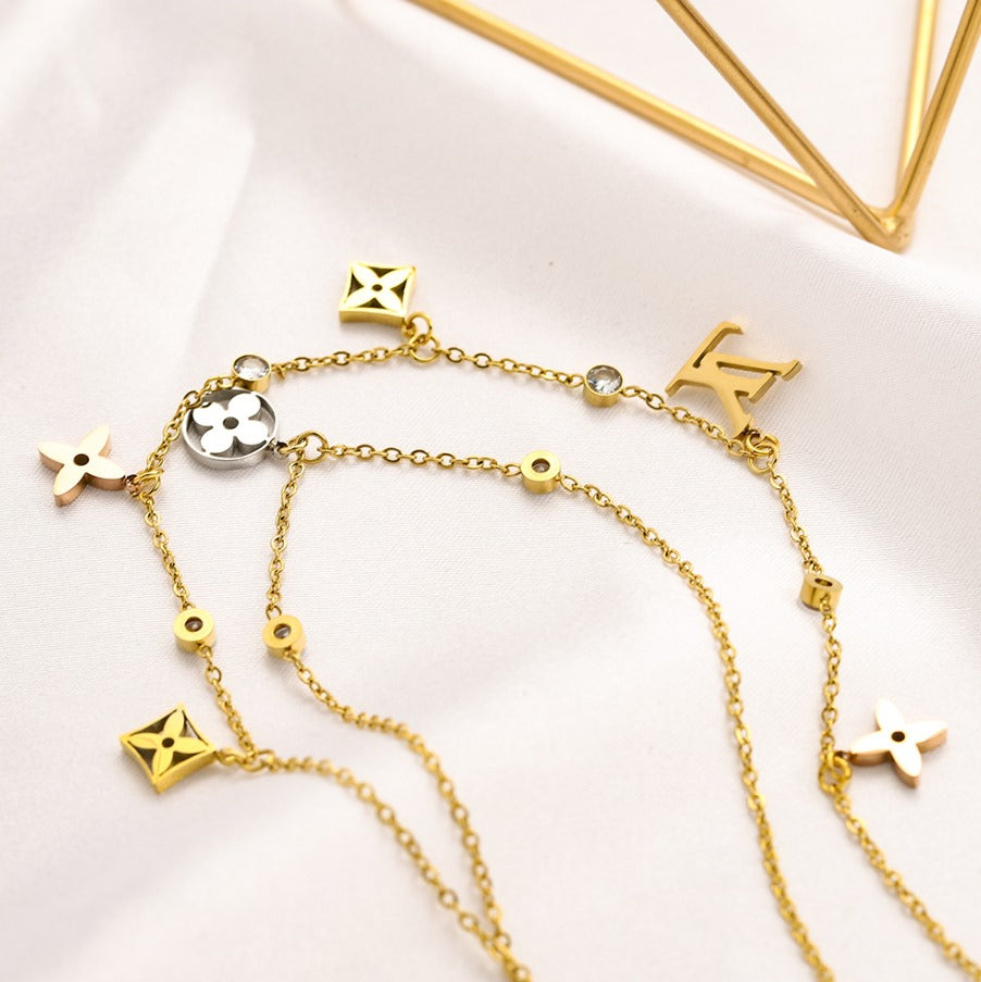 N-LV77. LV Stainless steel, Waterproof, Double layered Necklace with pendant and zirconstones..