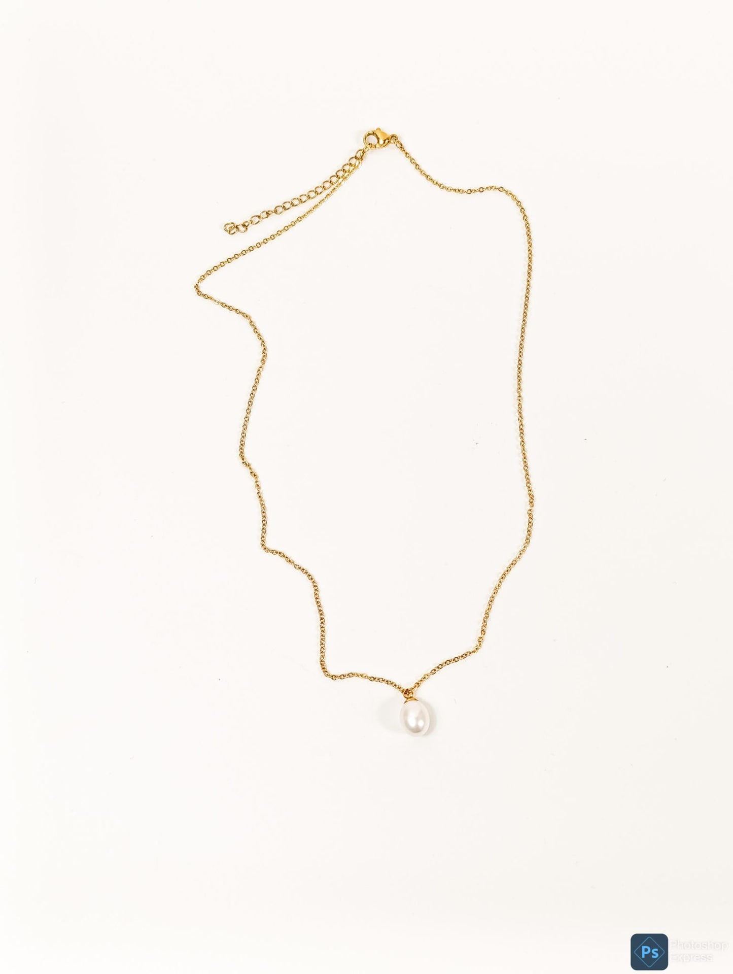Necklace with pearl pendant.