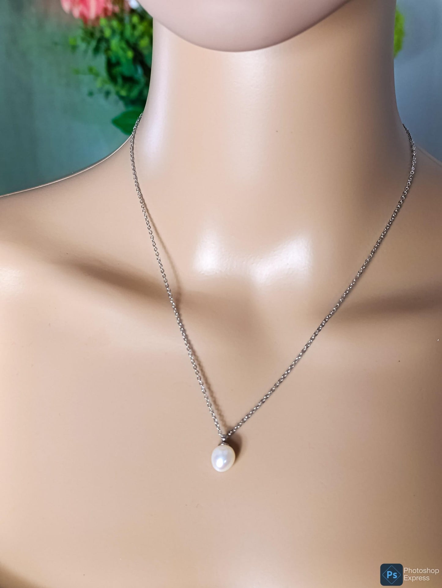 Necklace with pearl pendant.