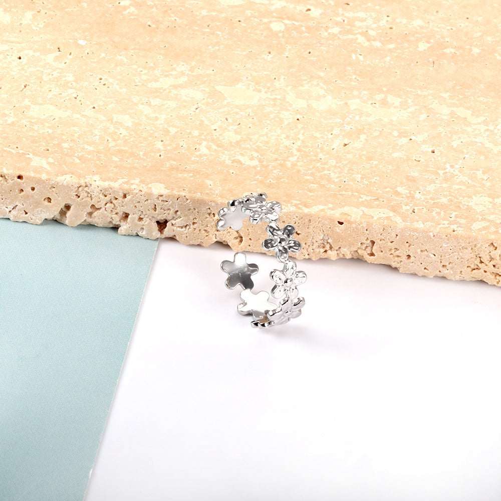 Ring with flower designs all over