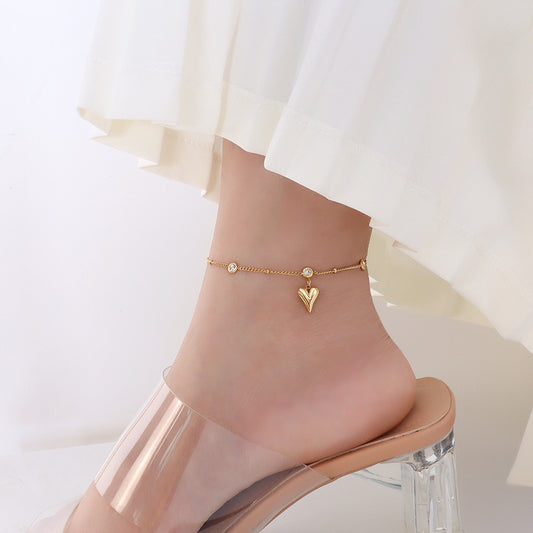 Single chain anklet with a heart dropping and stones around it