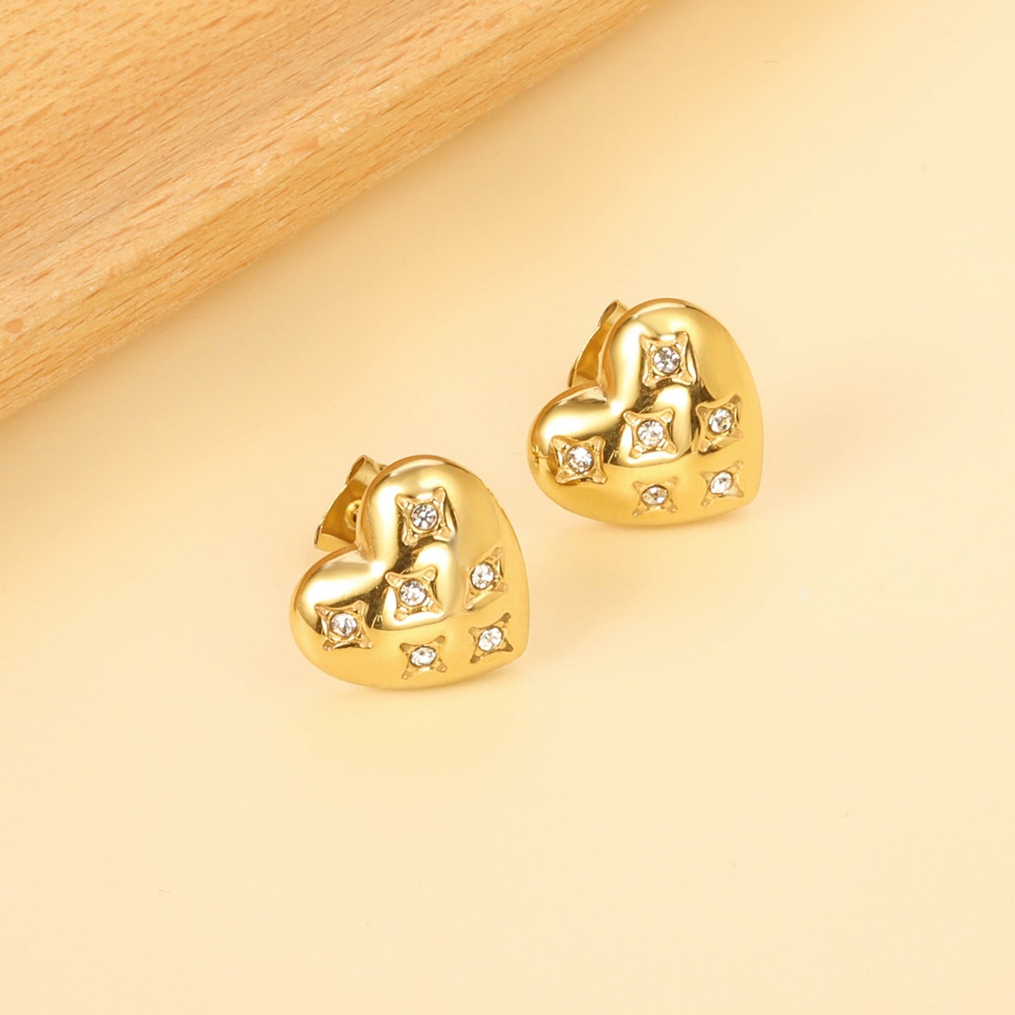 Heart shaped studs with stones