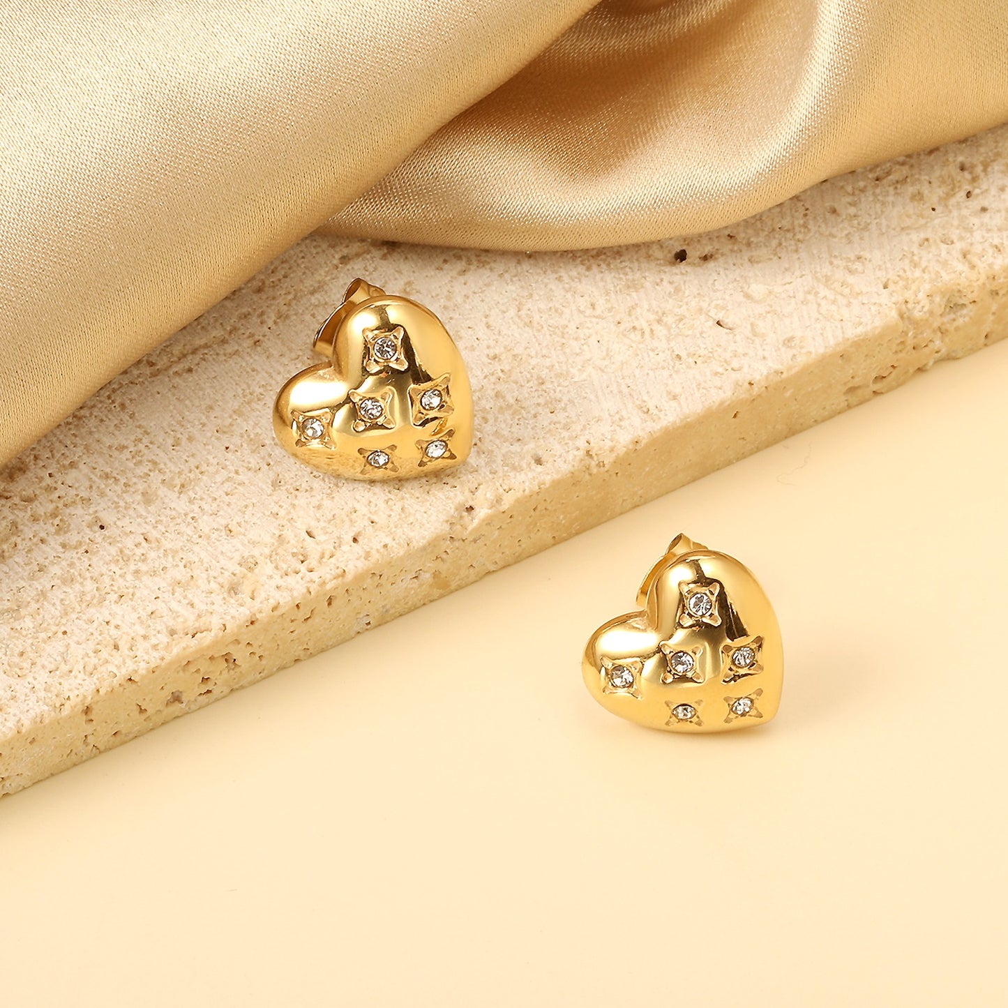 Heart shaped studs with stones