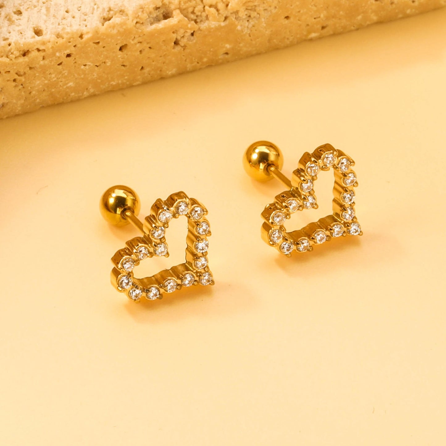 Heart shaped  screw studs with zircon stones.