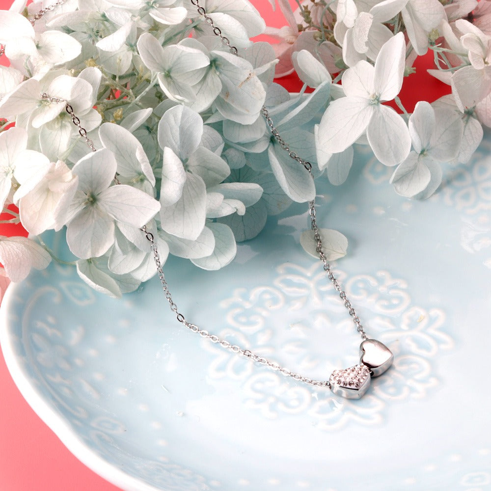 Silver necklace with two hearts pendant