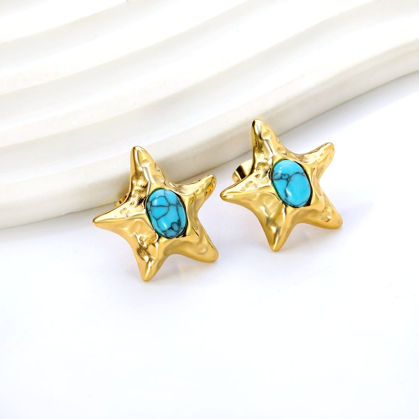 Star bold stud earring with blue in the middle
