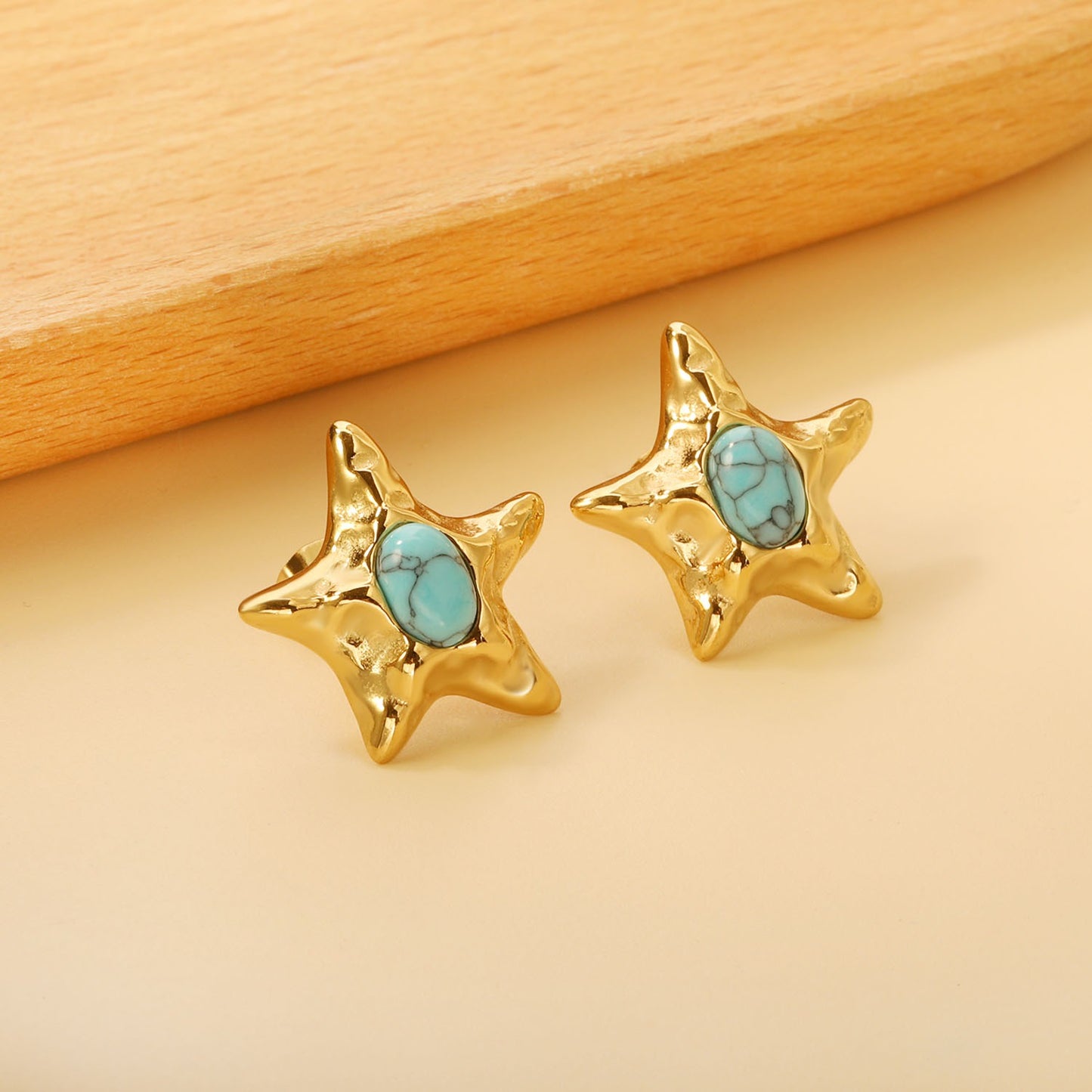 Star bold stud earring with blue in the middle