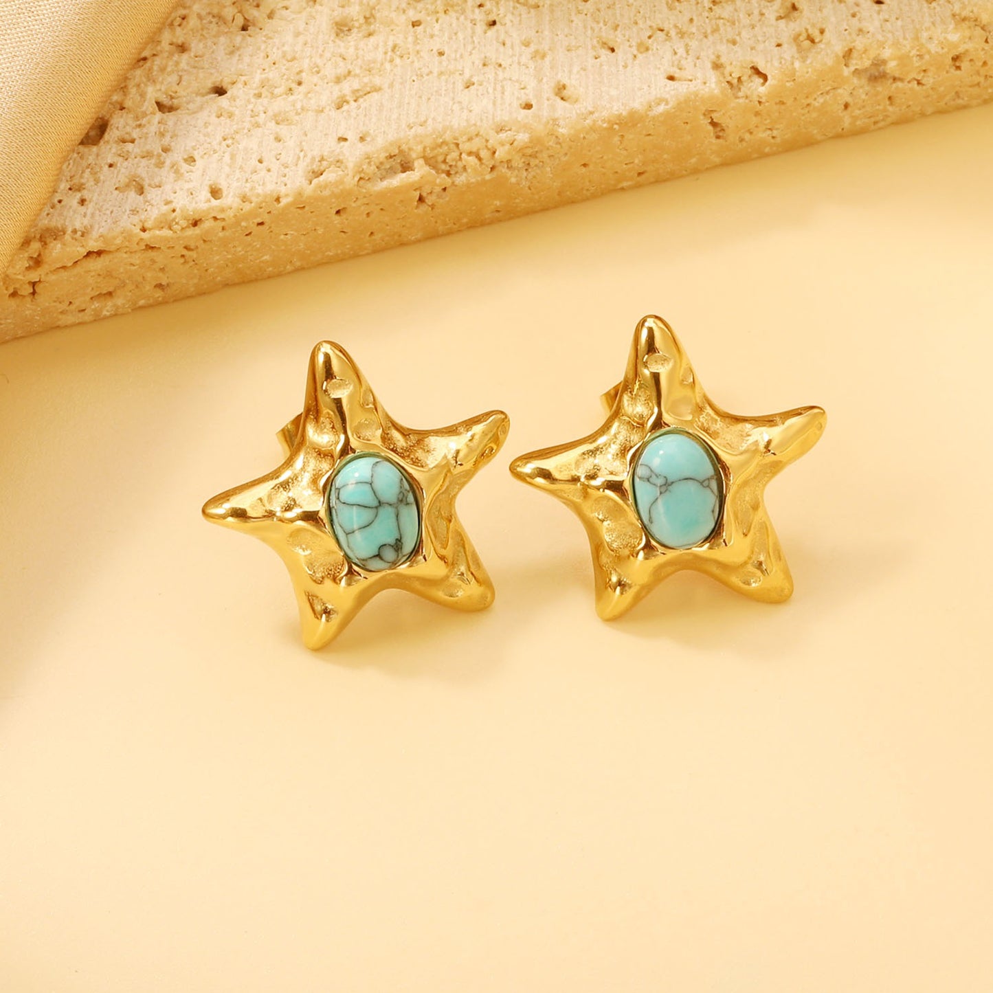 Star bold stud earring with blue in the middle