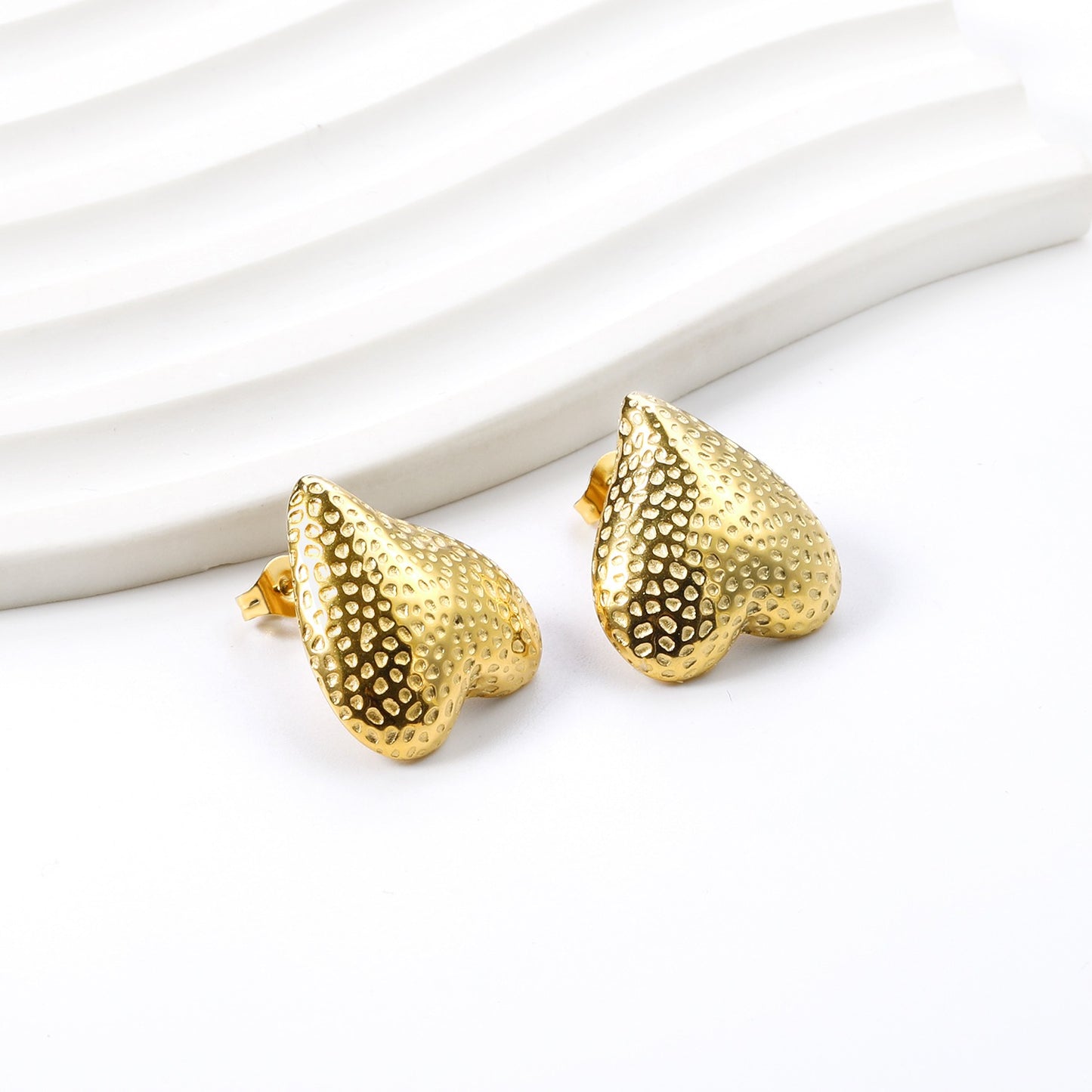 Upside down heart shaped bold studs