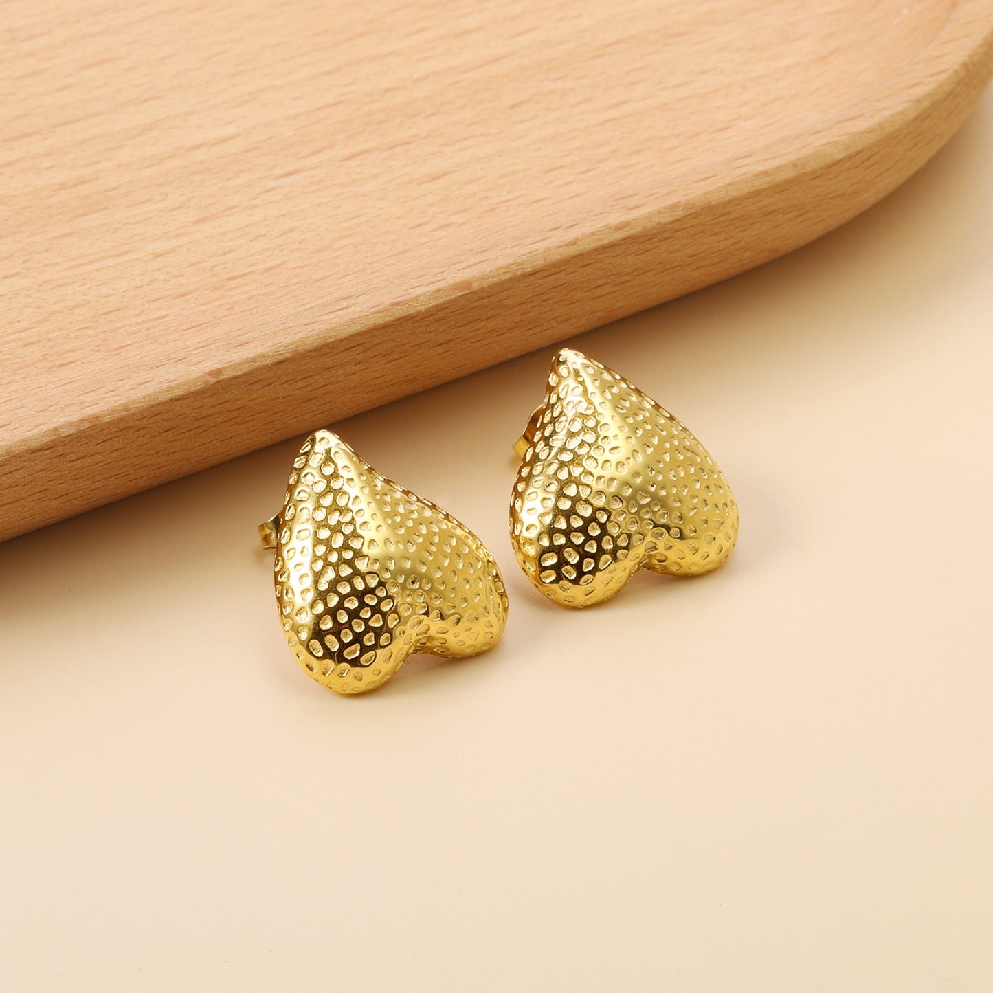 Upside down heart shaped bold studs