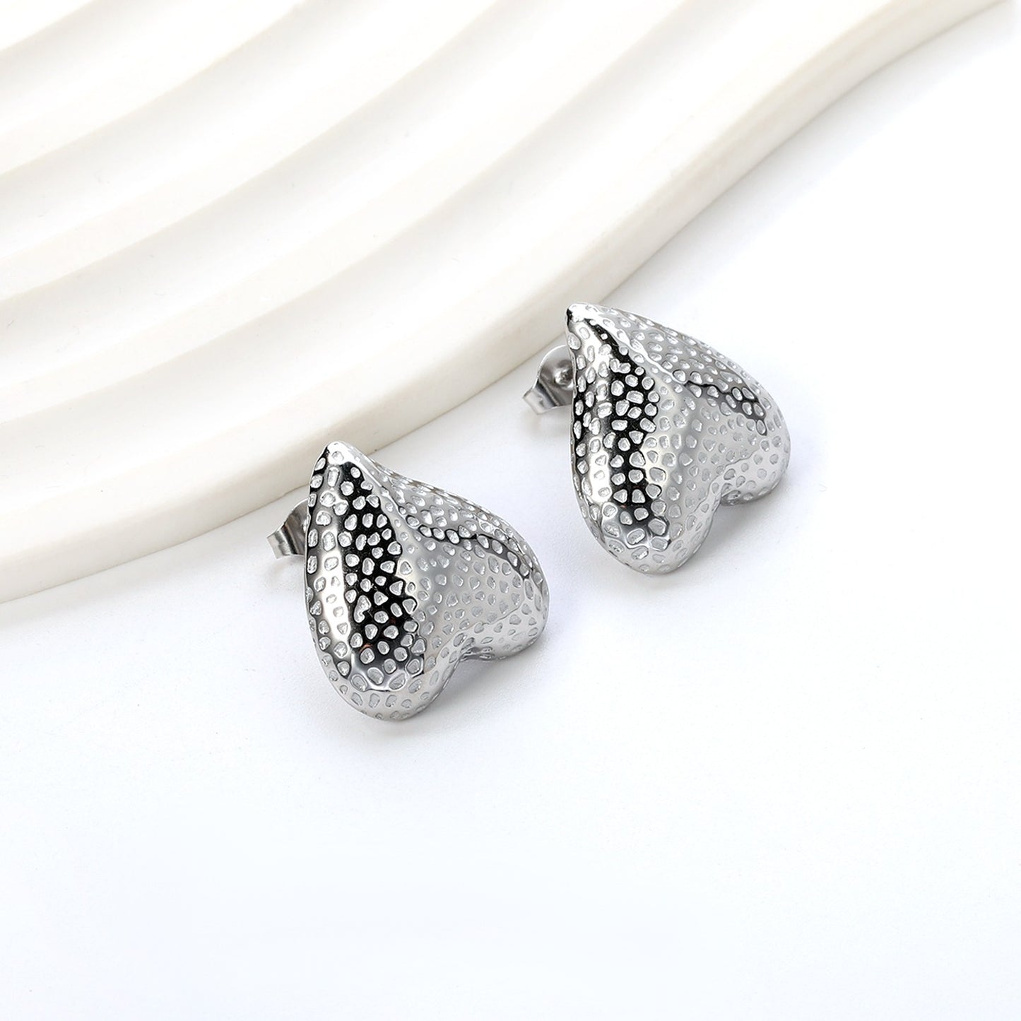Upside down heart shaped bold studs