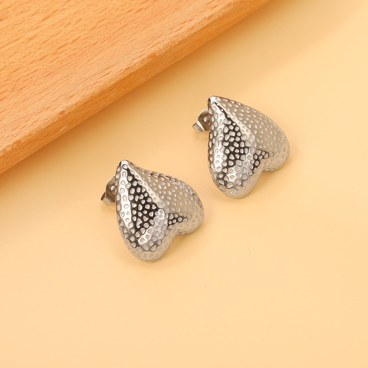 Upside down heart shaped bold studs