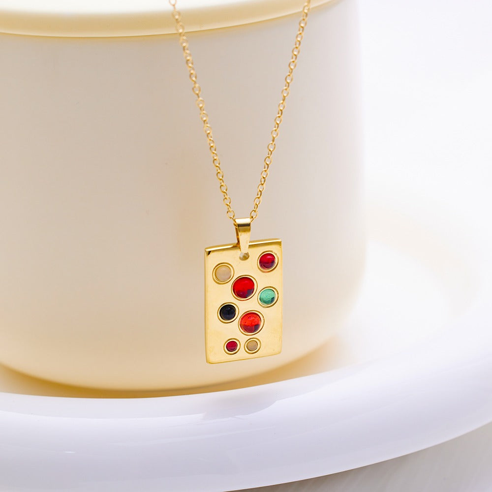 Necklace with rectangular pendant with various color stones