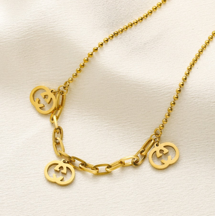 N-Gucci14. Gucci stainless steel necklace with charms.