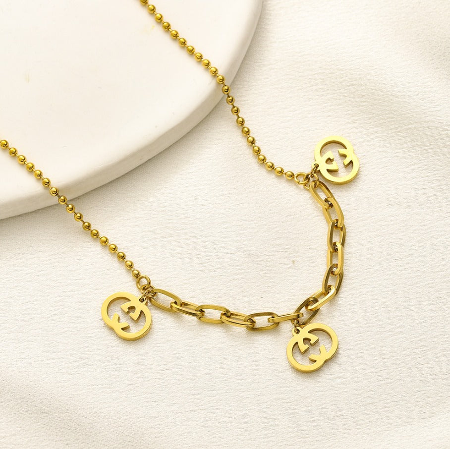 N-Gucci14. Gucci stainless steel necklace with charms.