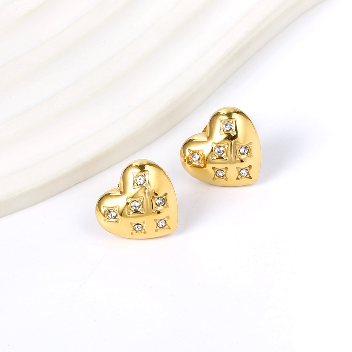 Heart shaped studs with stones