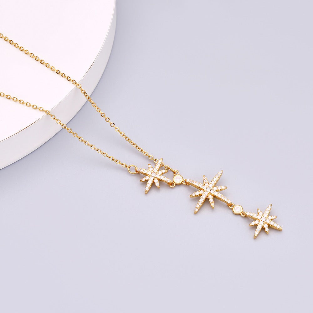 Necklace with elongated chain design and 3 stars pendant with stones