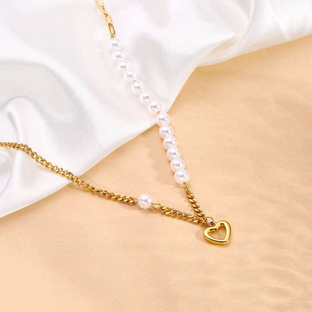 Necklace with chain and pearls with a heart pendant