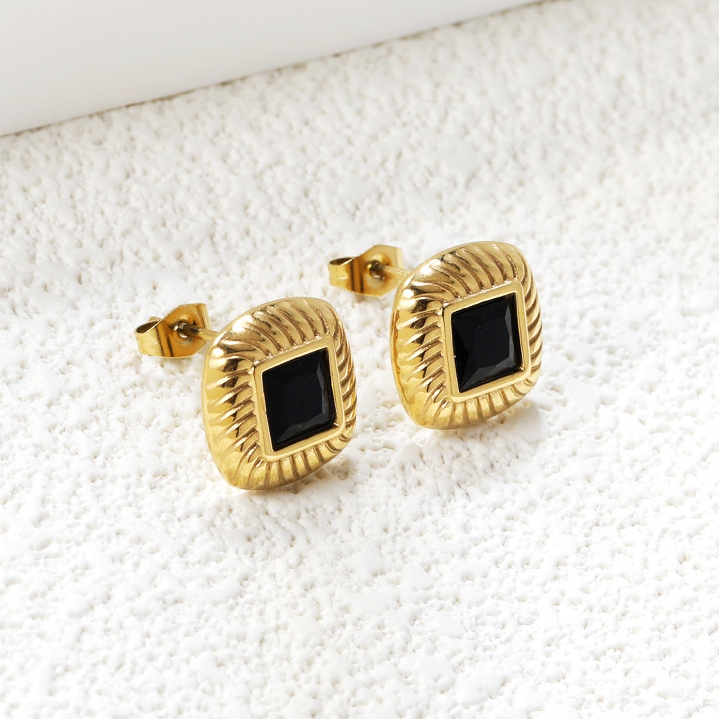 Square studs with a mini black square in the middle