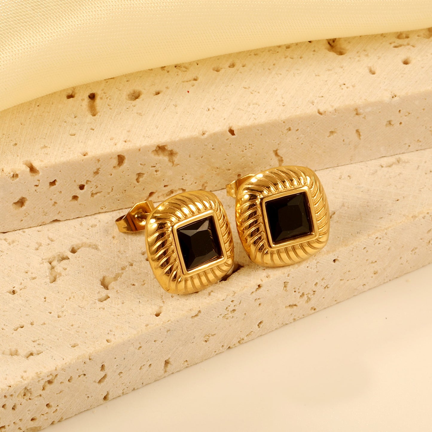 Square studs with a mini black square in the middle