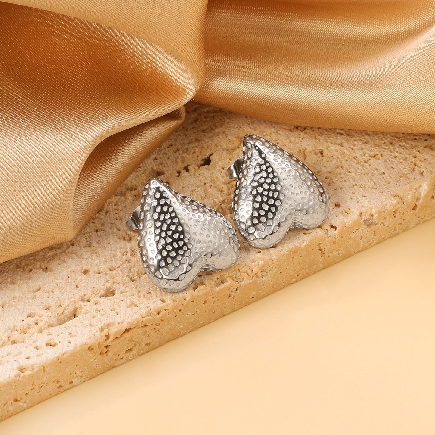 Upside down heart shaped bold studs